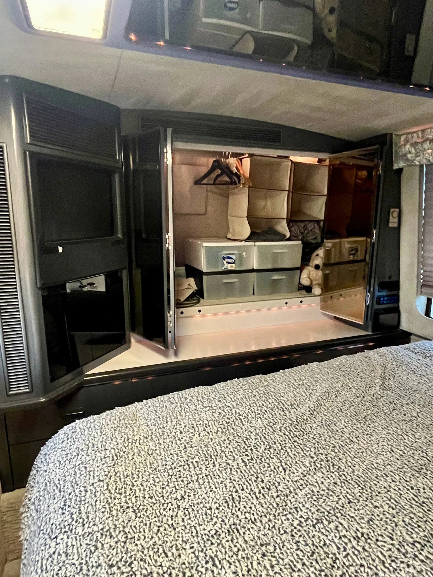 Full wardrobe with hanging space and storage bins