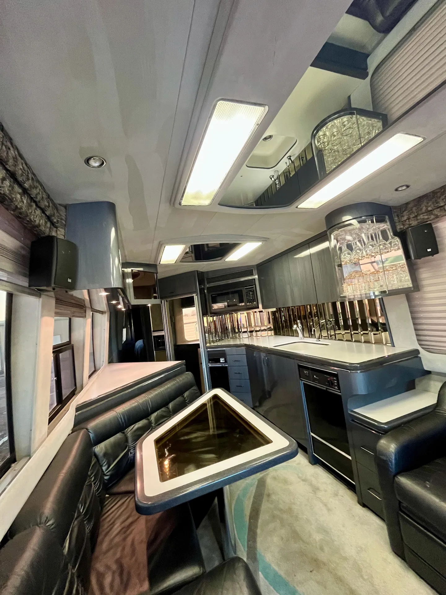 Salon toward galley with crystal wine glass storage