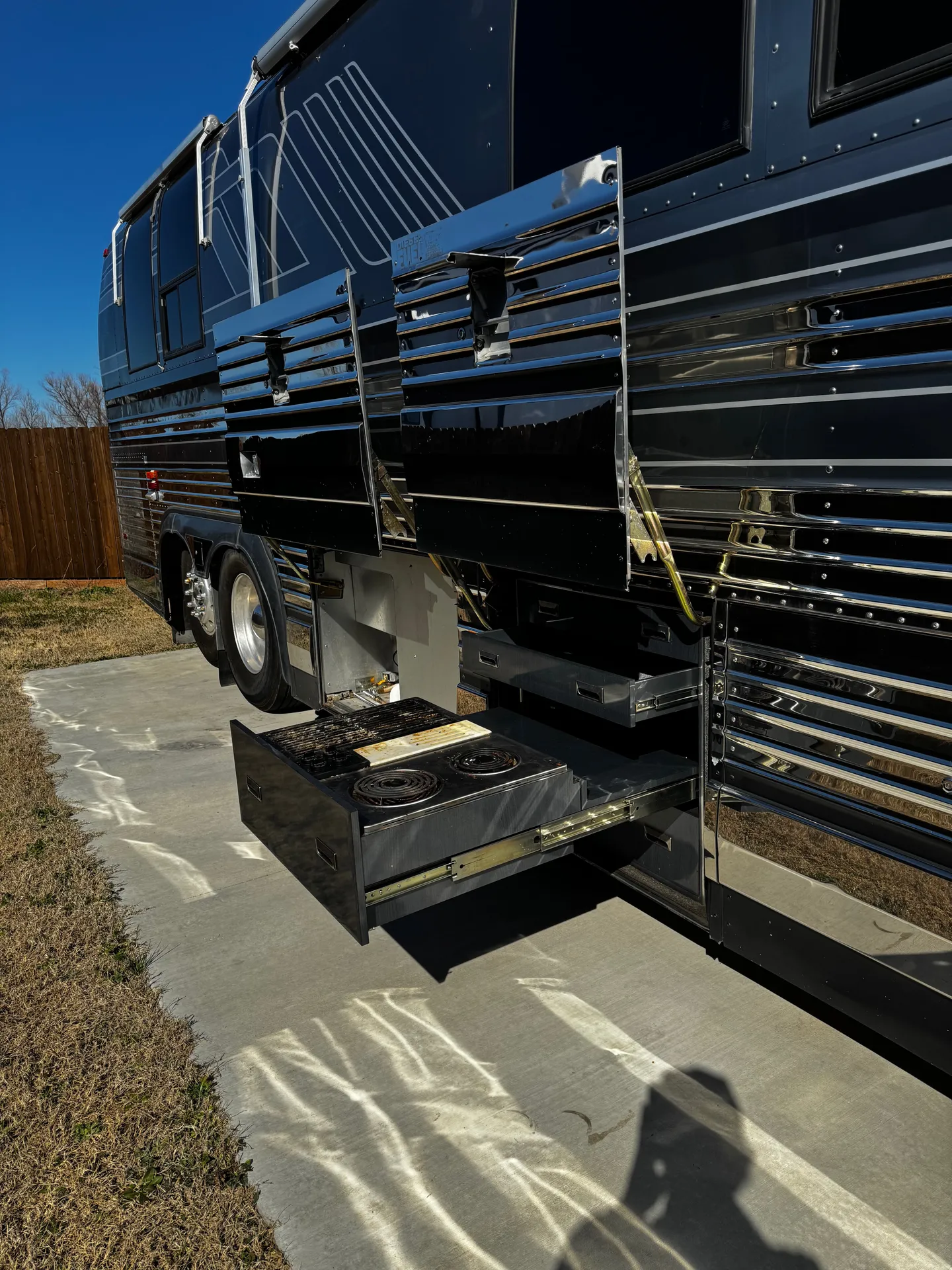 Pass-through storage with slide-out trays